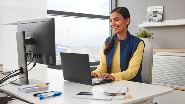 IKEA customer service employer in front of her computer.