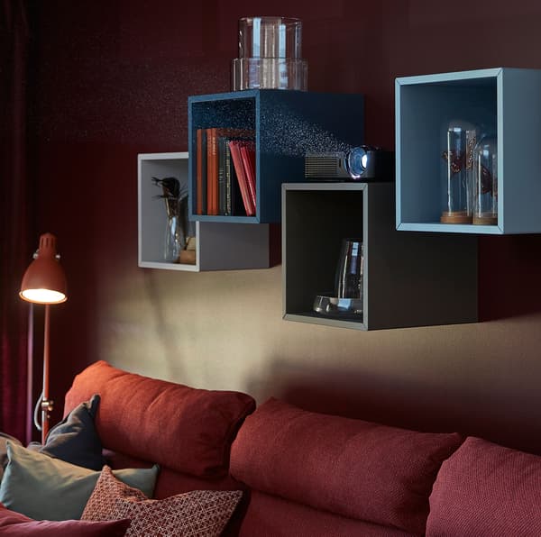IKEA EKET square-shaped open storage shelf cabinets in blue, light grey and dark grey colourways.