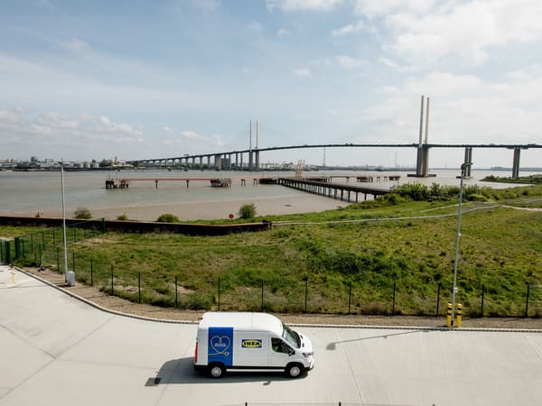 IKEA electric vehicle outside IKEA's new distribution centre in Dartford Kent, against the backdrop of the Dartford Crossing. 