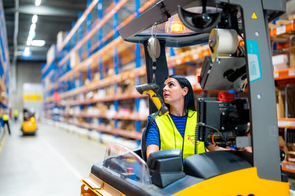 IKEA employee drives a forklift.