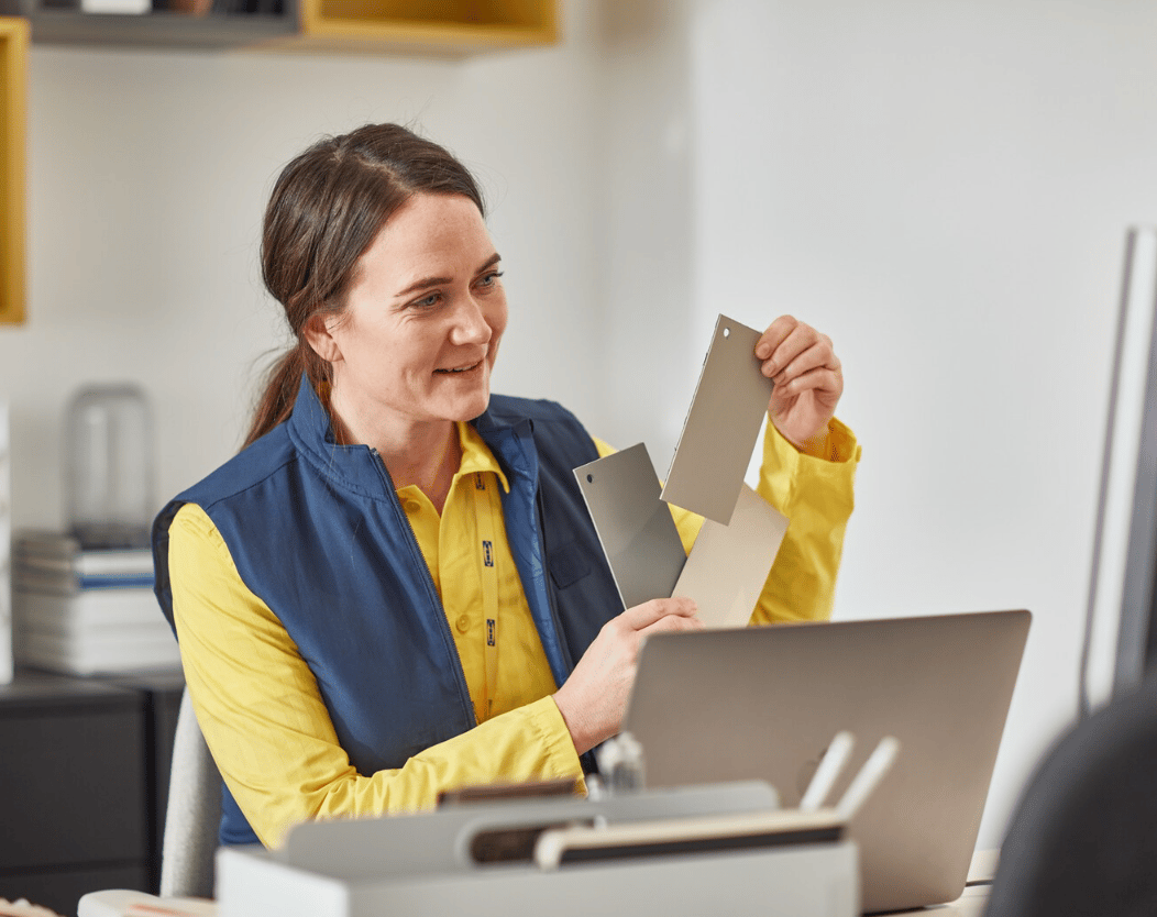 IKEA employee showing various materials.