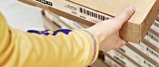 IKEA employee with IKEA cardboard box