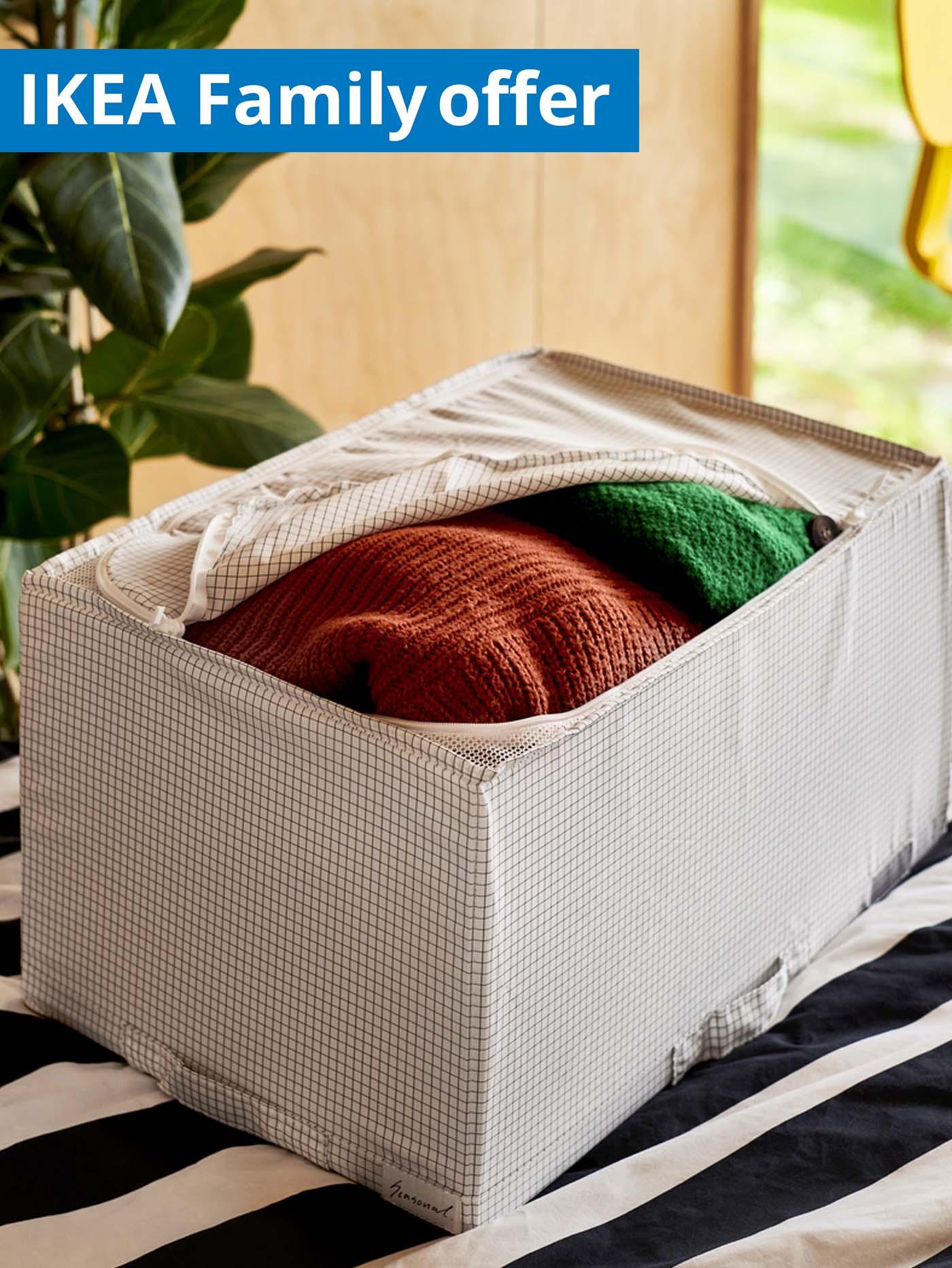 IKEA Family offer, 1-30 September 2026. Clothing in a slightly unzipped STUK storage box.