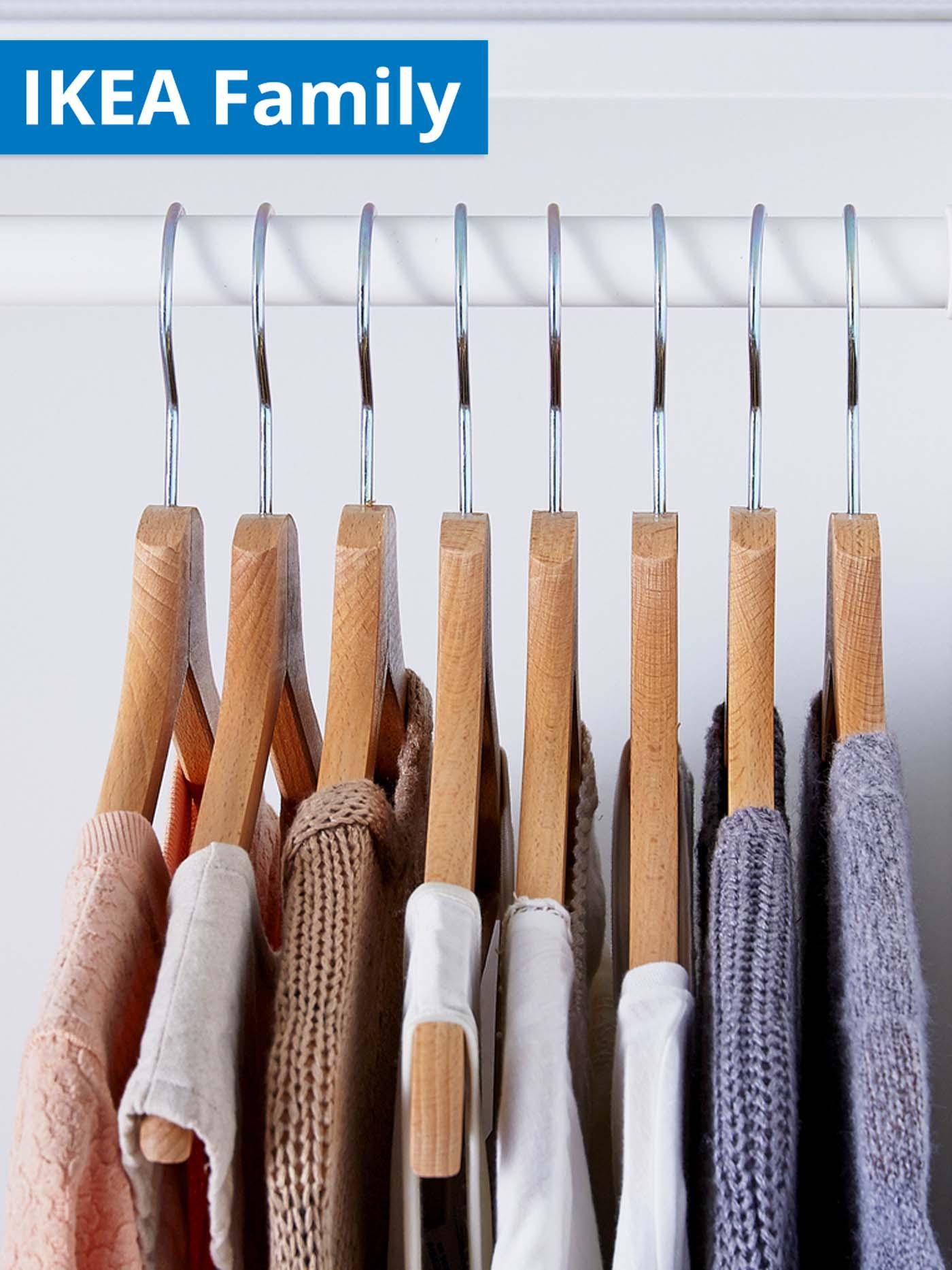 IKEA Family offer. Different clothes hanging on BUMERANG clothes hanger in wardrobe.