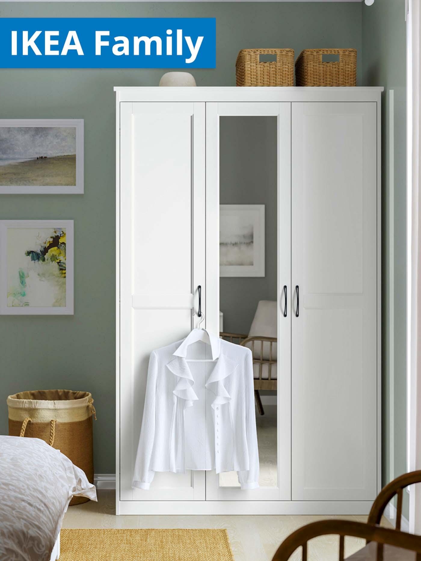 IKEA Family offer. White SONGESAND wardrobe with mirror in the bedroom.