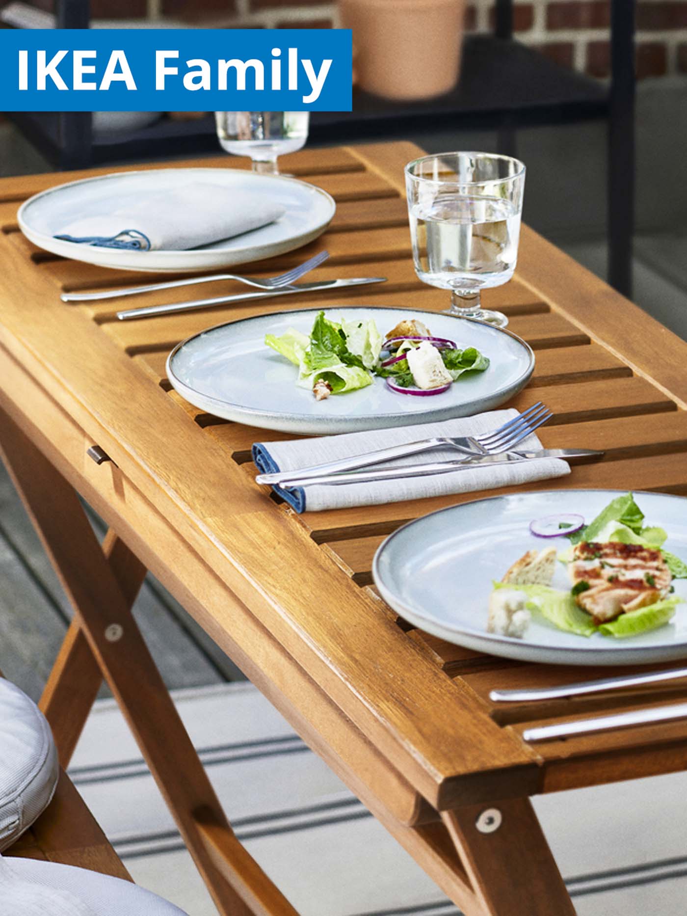IKEA Family offers for Chinese New Year. GLADELIG plates placed on outdoor NAMMARO folding table in balcony/patio area.