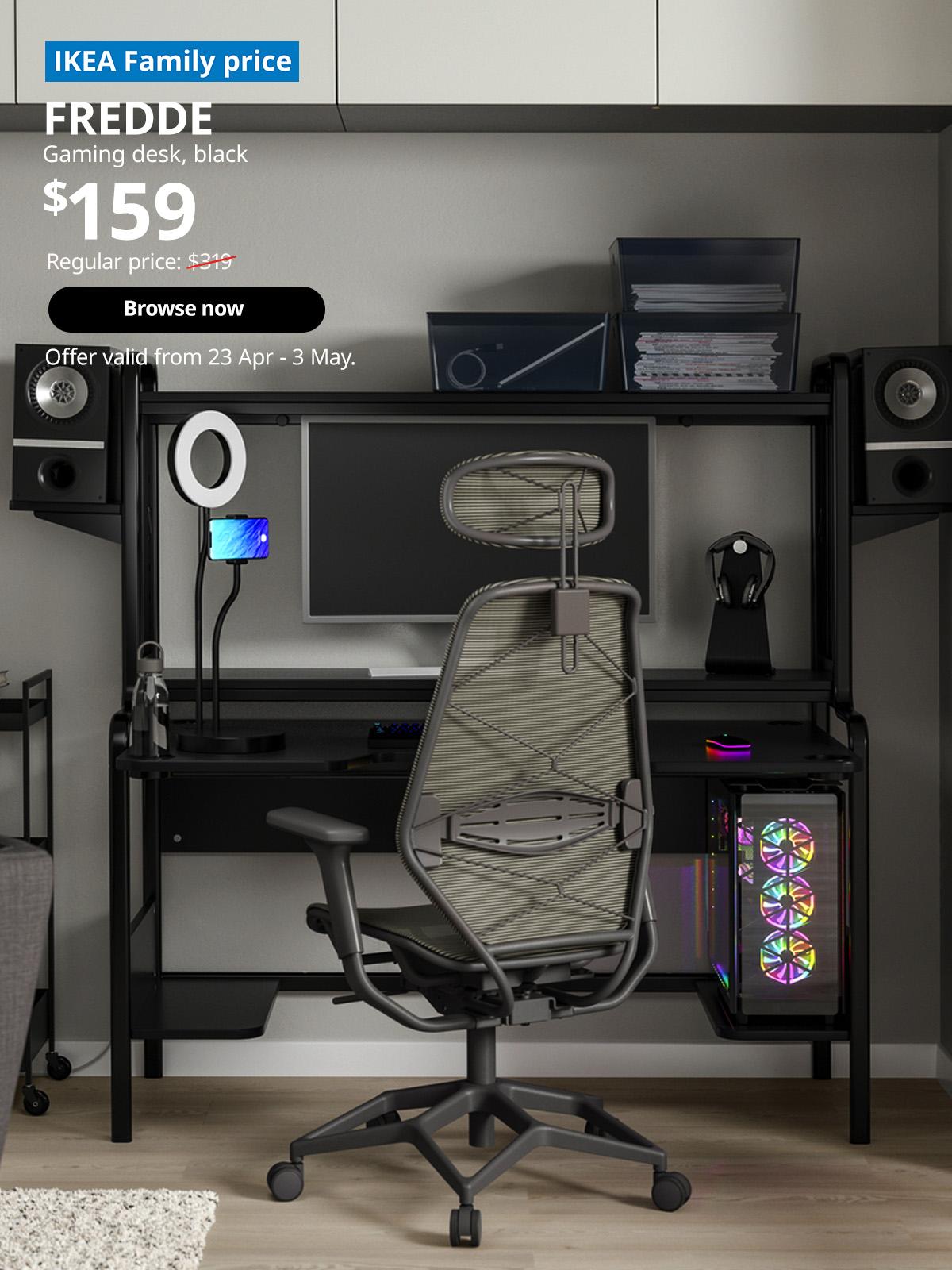 IKEA Family price tag at top left corner. Black FREDDE gaming desk, 140/185x74x146 cm. Price: $159. Regular price: $319. Offer valid from 23 Apr - 3 May, for High Five IKEA campaign.