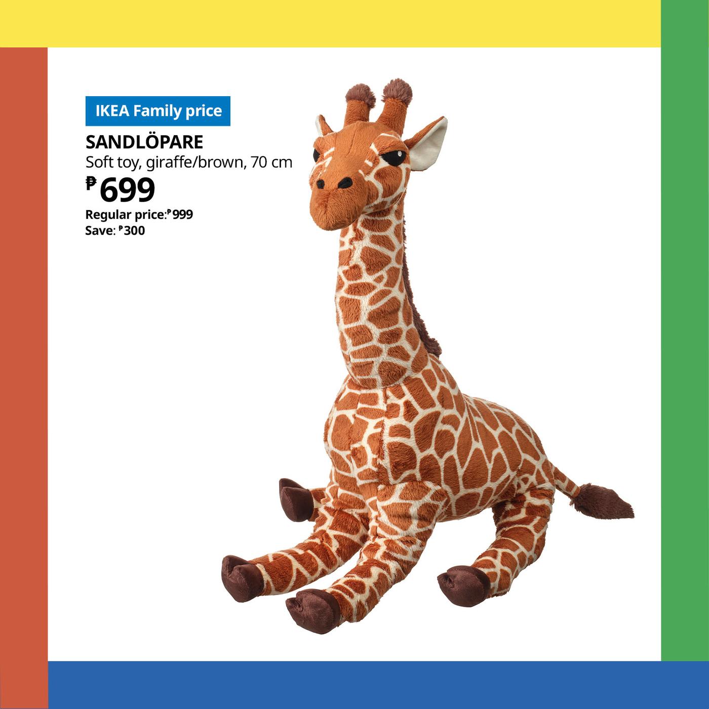 IKEA Family “Soft toy of the month” ad featuring a seated brown-and-cream stuffed giraffe, priced at ₱699, on a clean white background.