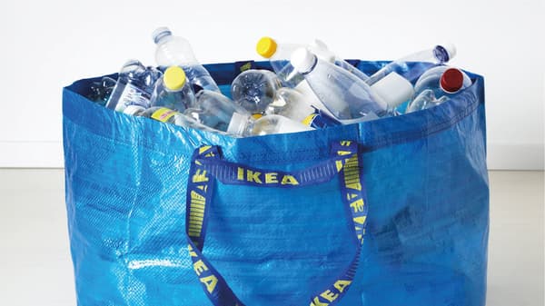 IKEA frakta bag filled with empty bottles