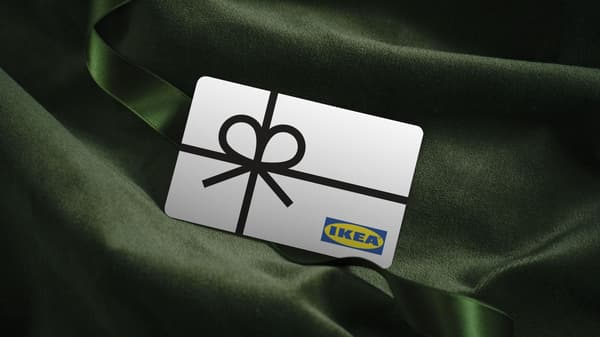 IKEA gift card with black ribbon tied into a bow
