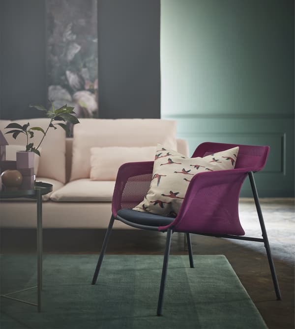 IKEA has a variety of pink and green decor for your living room like rugs, sofas, vases and cushions. IKEA PS 2017 armchair is lightweight and modern with a woven mesh pink shell and a blue seat.