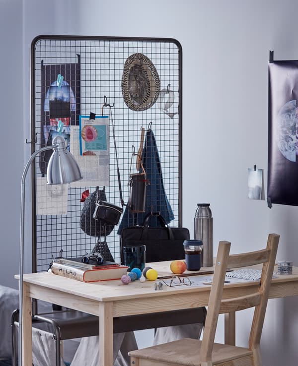 IKEA has lots of cool room dividers for your dorm like VEBERÖD room divider that can be used for decoration and storage. It has a wire mesh wall and lots of hooks to hang baskets and such. Castors let you roll it where you need it!