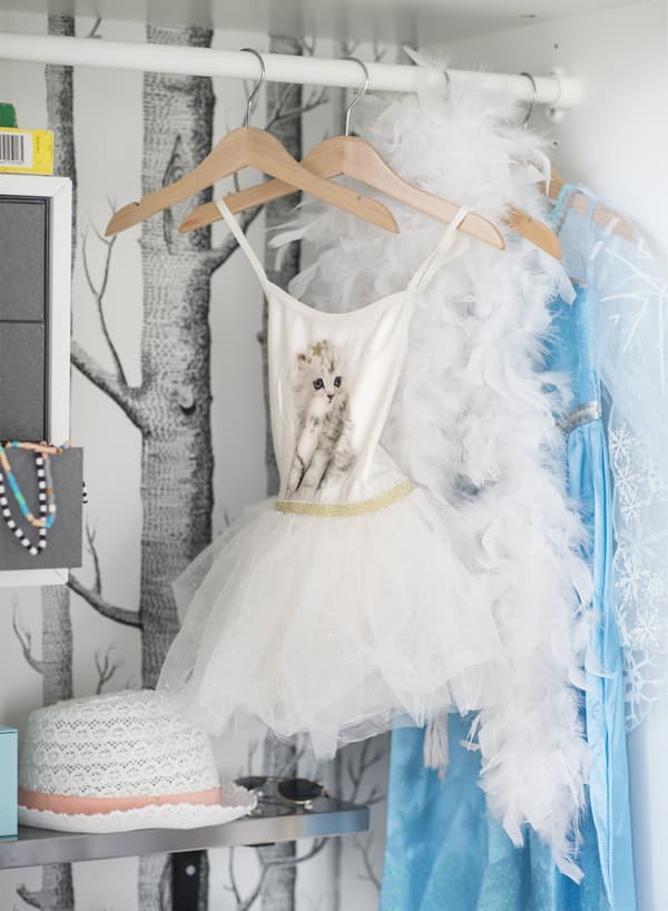IKEA has toy storage ideas like transforming the inside of an old wardrobe into a toy box. Use KOMPLEMENT clothes rail in white to make hanging space for fancy dress outfits your child can wear during a dramatically creative performance.