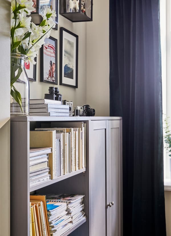 IKEA HAVSTA light grey storage unit with four open shelves and a pair of closed storage cabinet doors.