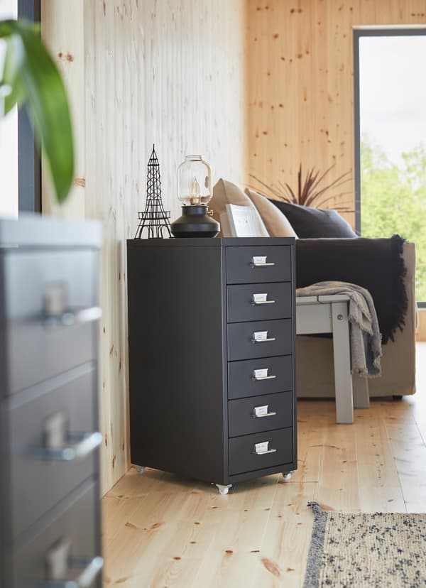 IKEA HELMER black portable drawer unit on castor wheels with 6 drawers.