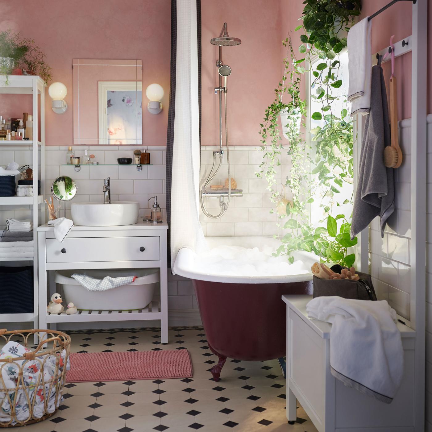 IKEA HEMNES white open washstand has a freestanding shelf below to quickly grab towels and toiletries. It can even fit a baby bathtub underneath as well!