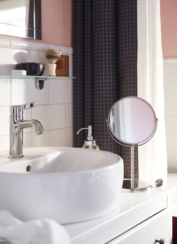 IKEA HEMNES white washbasin provides more countertop space for mirrors and soap bottles. Pair it with a chrome-plated VOXNAN sink tap for a sleek look.