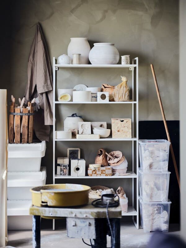IKEA JONAXEL shelving unit holding pottery tools in the garage.