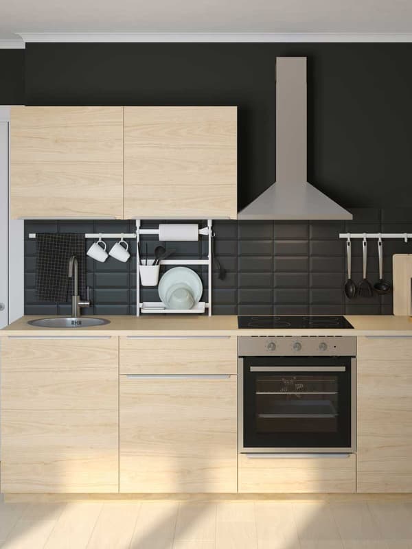 IKEA kitchen in a light wood with matching wooden kitchen top.