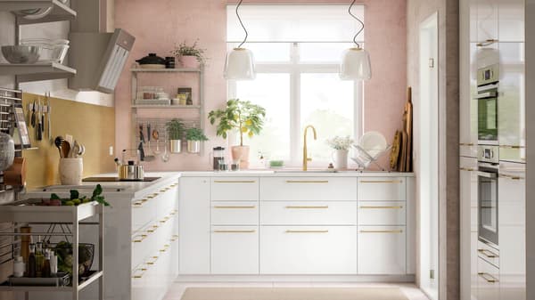 IKEA KUNGSFORS stainless steel kitchen with light pink walls.