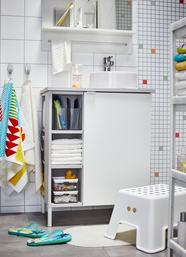 IKEA LILLÅNGEN small white wash cabinet comes with a combination of open storage shelves and closed cabinets in the front and side to maximise space.
