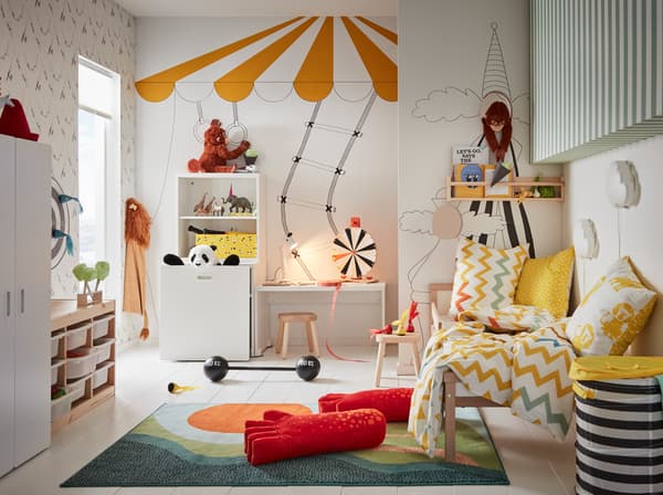 IKEA LUSTIG toy series and boardgames in a circus-themed children's bedroom.