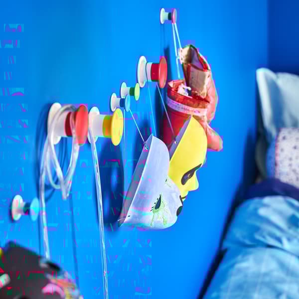 IKEA LUSTIGT colourful masks hung on LOSJÖN mounted hooks.
