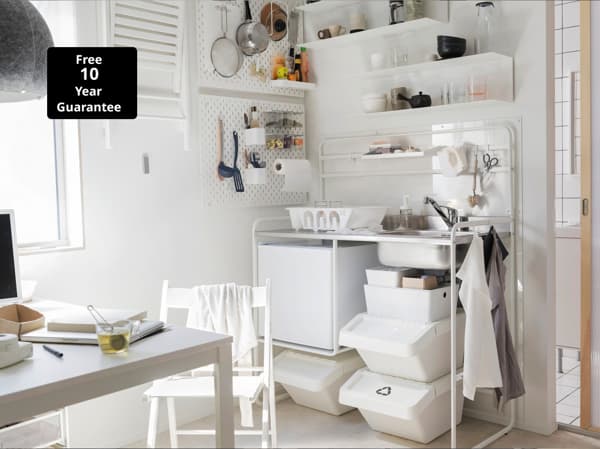 IKEA MELLTORP white table and SUNNERSTA mini-kitchen range complete this small white-styled kitchenette.