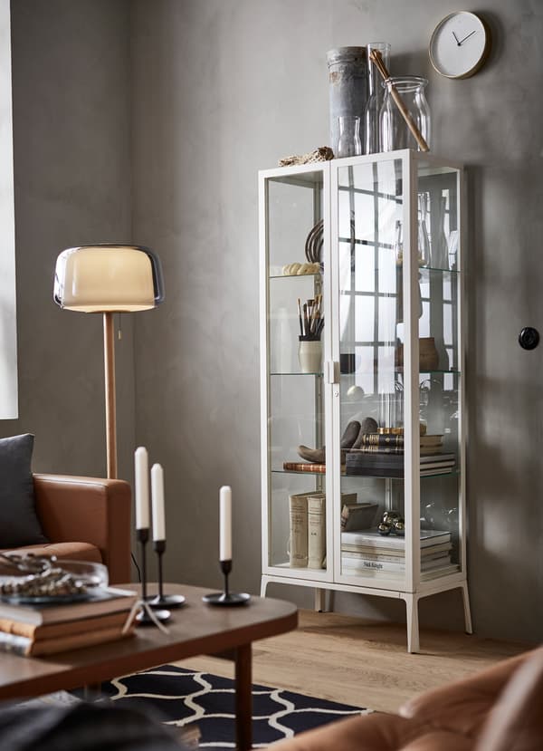IKEA MILSBO glass cabinet with a white frame.