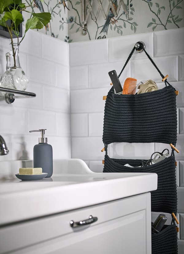 IKEA NORDRANA dark blue woven hanging 3 pockets are deep and sturdy enough to hold hairdryers, curling irons, combs and other small bathroom appliances.