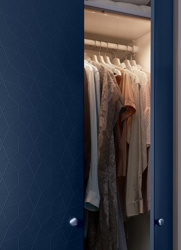 IKEA NORRFLY motion-activated LED lighting strips can be installed inside PAX storage wardrobe solution to illuminate your clothes in the dark or early mornings.