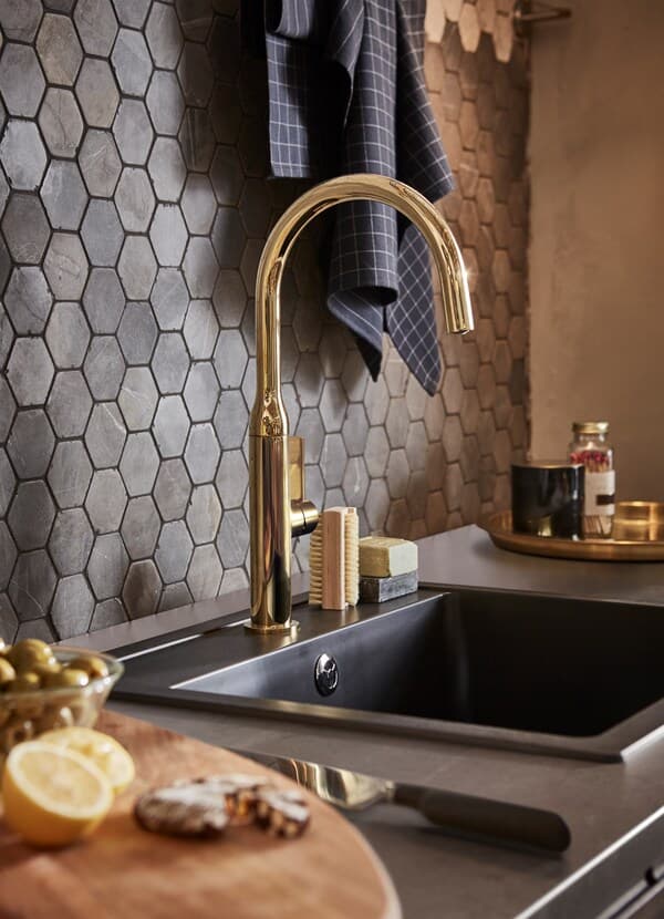 IKEA NYVATTNET golden-brass sink tap and HÄLLVIKEN deep black quart kitchen sink.