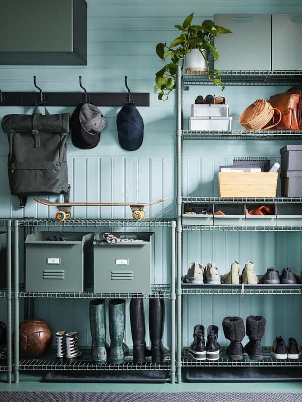 IKEA OMAR crome plated shelving unit used for shoe storage in the garage.