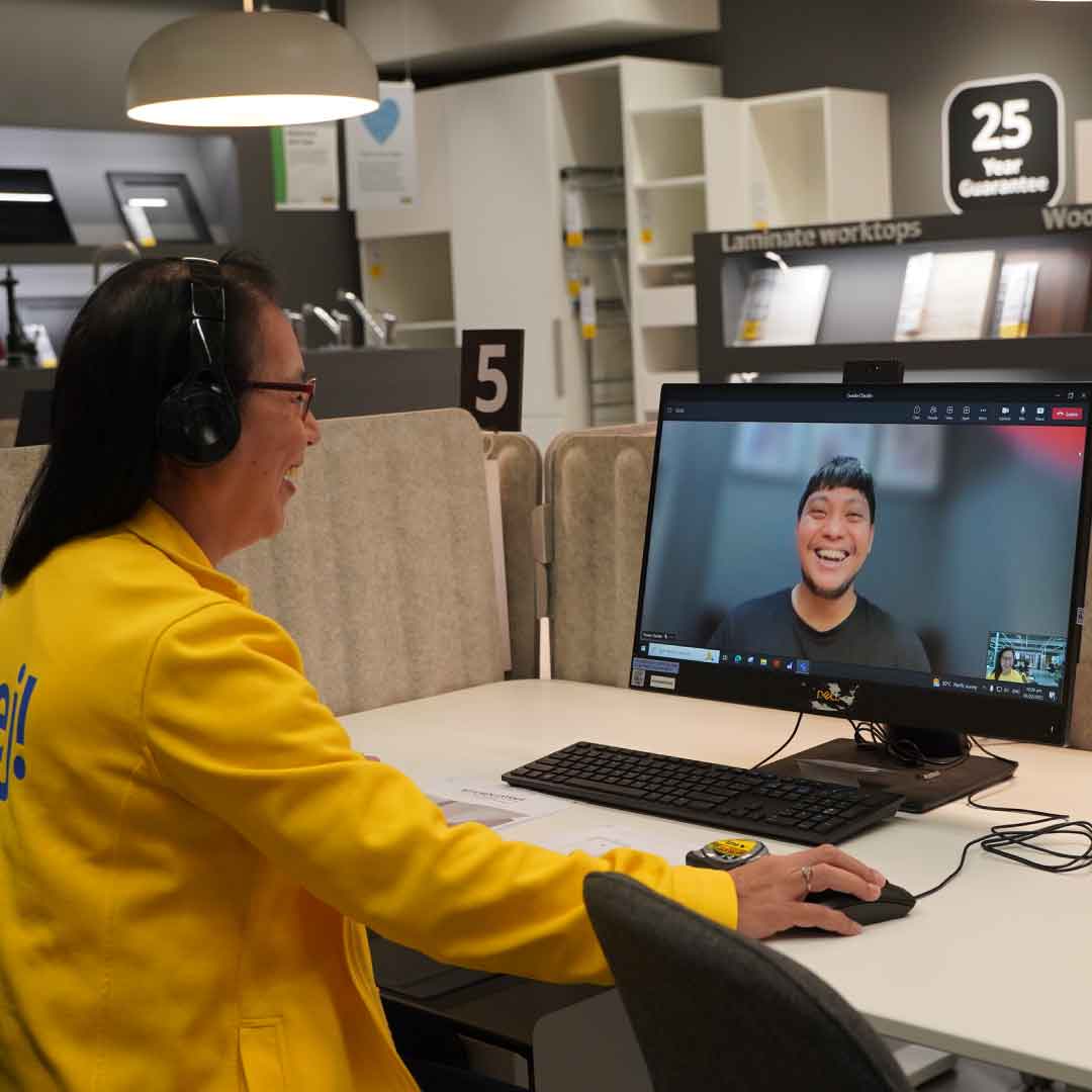 IKEA Online Planning co-worker is attending to customers on his needs.