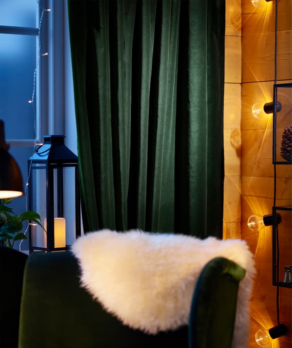 IKEA SANELA dark green cotton curtains are simple to hang and easy to draw at bedtime.
