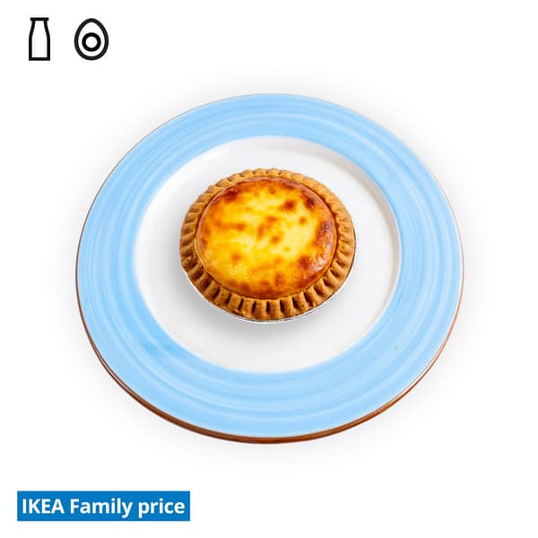 IKEA Singapore Family Food offers at Swedish Restaurant — D24 Durian cheese tart on a blue/white side plate. Food allergen symbols of dairy and egg in black on the top left-hand. The IKEA Family price tag is displayed in blue and white text, positioned at the bottom left of the image.