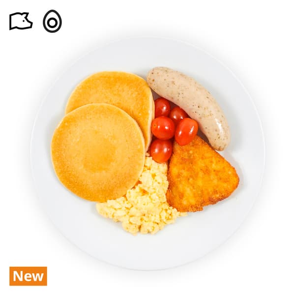 IKEA Singapore's Swedish Restaurant breakfast — Pancakes Breakfast platter; Pancakes with pork bratwurst, butter croissant, scrambled egg, hashbrown and cherry tomato. A pork and egg food symbol is seen on the top left corner.