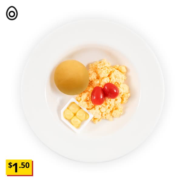 IKEA Singapore's Swedish Restaurant's breakfast — Plain soft roll & scrambled egg breakfast set with 1 butter. A egg food symbol in black on the top left corner with a breath-taking price tag in yellow of $1.50.
