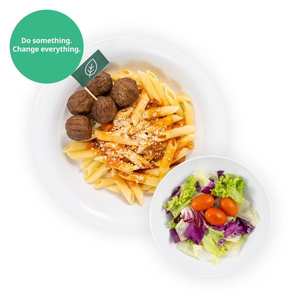 IKEA Singapore's Swedish Restaurant's IKEA Family offer — Organic plant ball pasta with penne pasta and mixed salad. A sustainability communication on the top left corner overlaying image in green with white text that reads 
