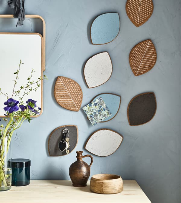 IKEA SJUDA pot stands painted in different colours being used as ‘don’t forget’ stations in a shared house.