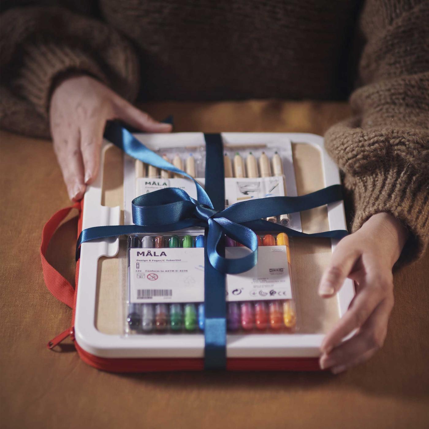 IKEA stationery products wrapped around in blue ribbon