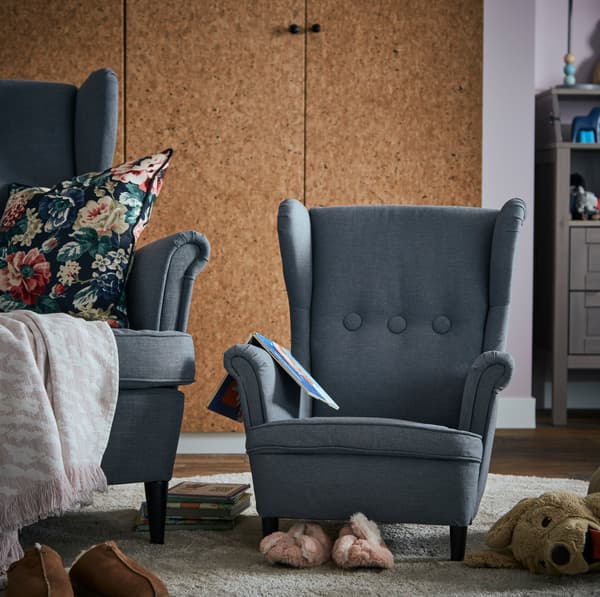 IKEA STRANDMON dark grey traditional armchairs ain an adult size and smaller, child's size.