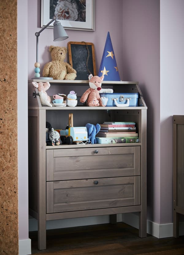 IKEA SUNDVIK dark brown and grey wood changing table being used as a dresser.
