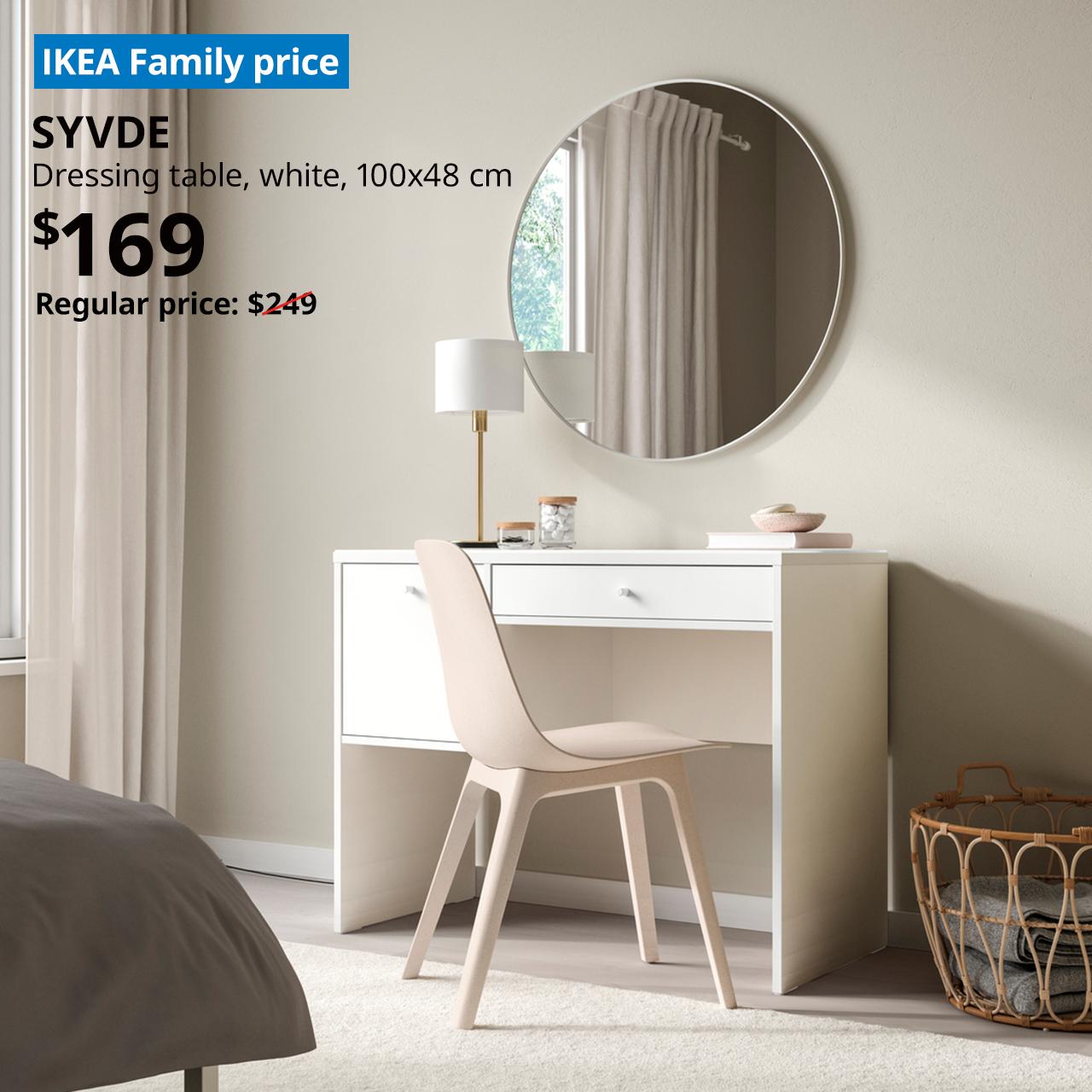 IKEA SYVVDE white dressing table (100×48 cm) styled with a round mirror and chair in a modern bedroom. IKEA Family price: $169, down from the regular price of $249.