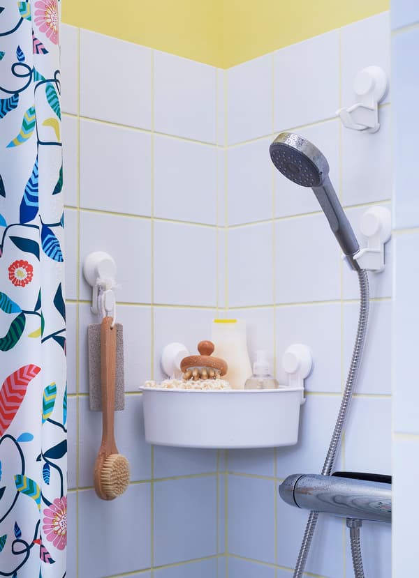 IKEA TISKEN white suction cup series is a no-drill bathroom solution. The shower head suction cup can be placed at different heights so both children and adults can reach. Attach a corner shelf basket to hold scrubs and shampoo.