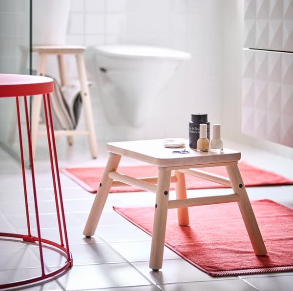 IKEA VILTO light birch wood step stool is versatile seating and foot propping that can slide perfectly underneath the VILTO shelving unit to store away when not in use.