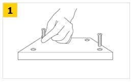 イケアの組み立て説明で、台形の板に2本のねじを指で立てて差し込むステップ1