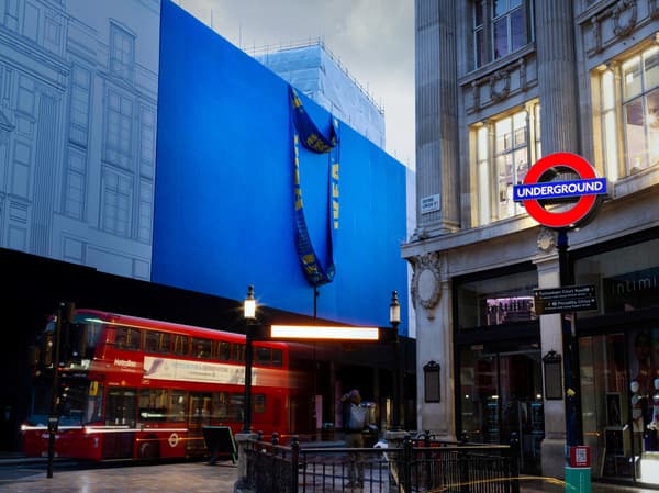 Image depicts facade of IKEA Oxford Street, covered in FRAKTA bag hoarding
