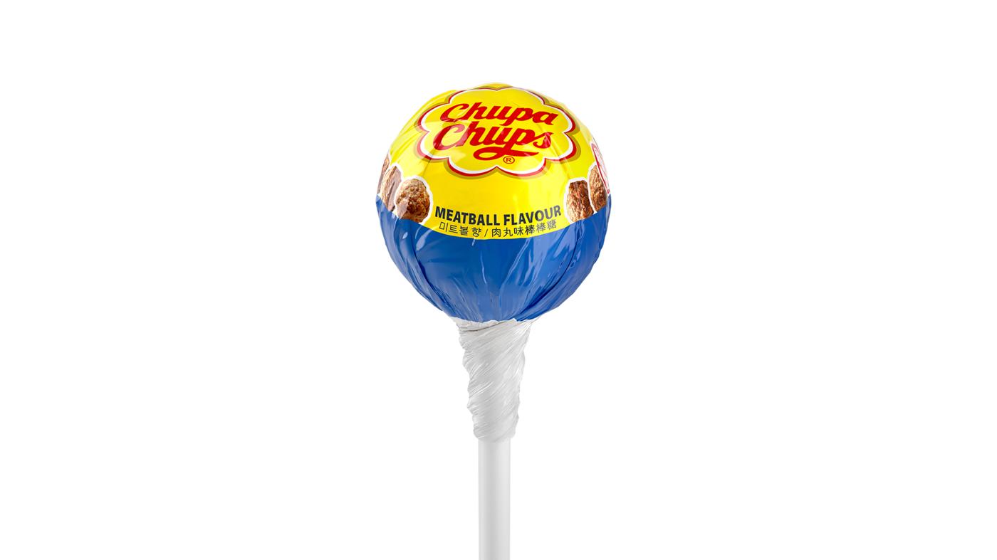Image of a lollipop with writing saying Chupa Chups and Meatball Flavour