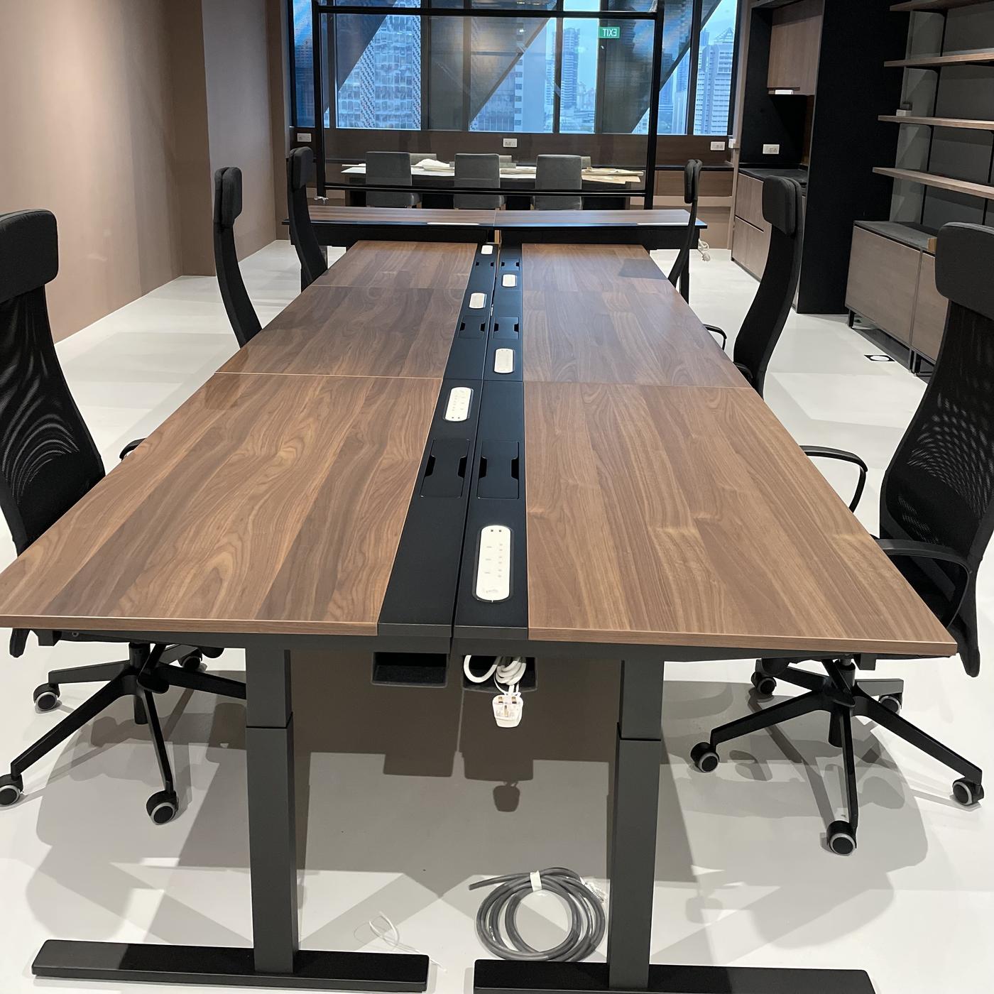 Image of brown IKEA MITTZON conference tables with black JARVFJALLET work chairs in a meeting/conference room in Singapore, designed by IKEA for Business: Business Interior Design Service